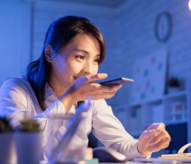 lady holding a mobile device on her right hand , living a massage