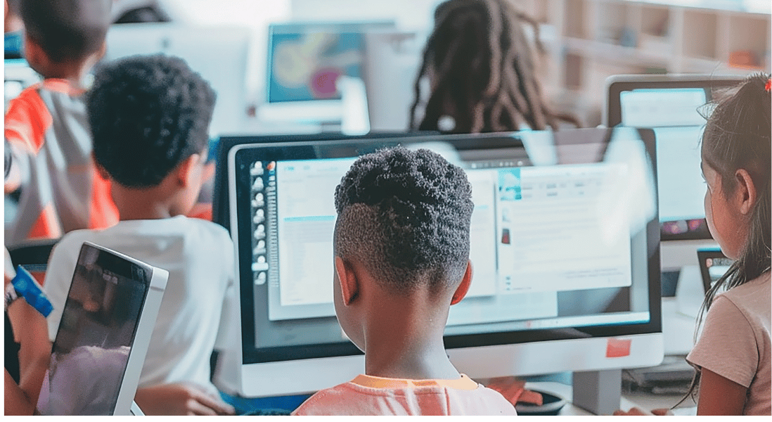 kids inside the classroom , computer screens and keyboards