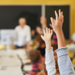 learners raising hands responding on why ai important in deucation